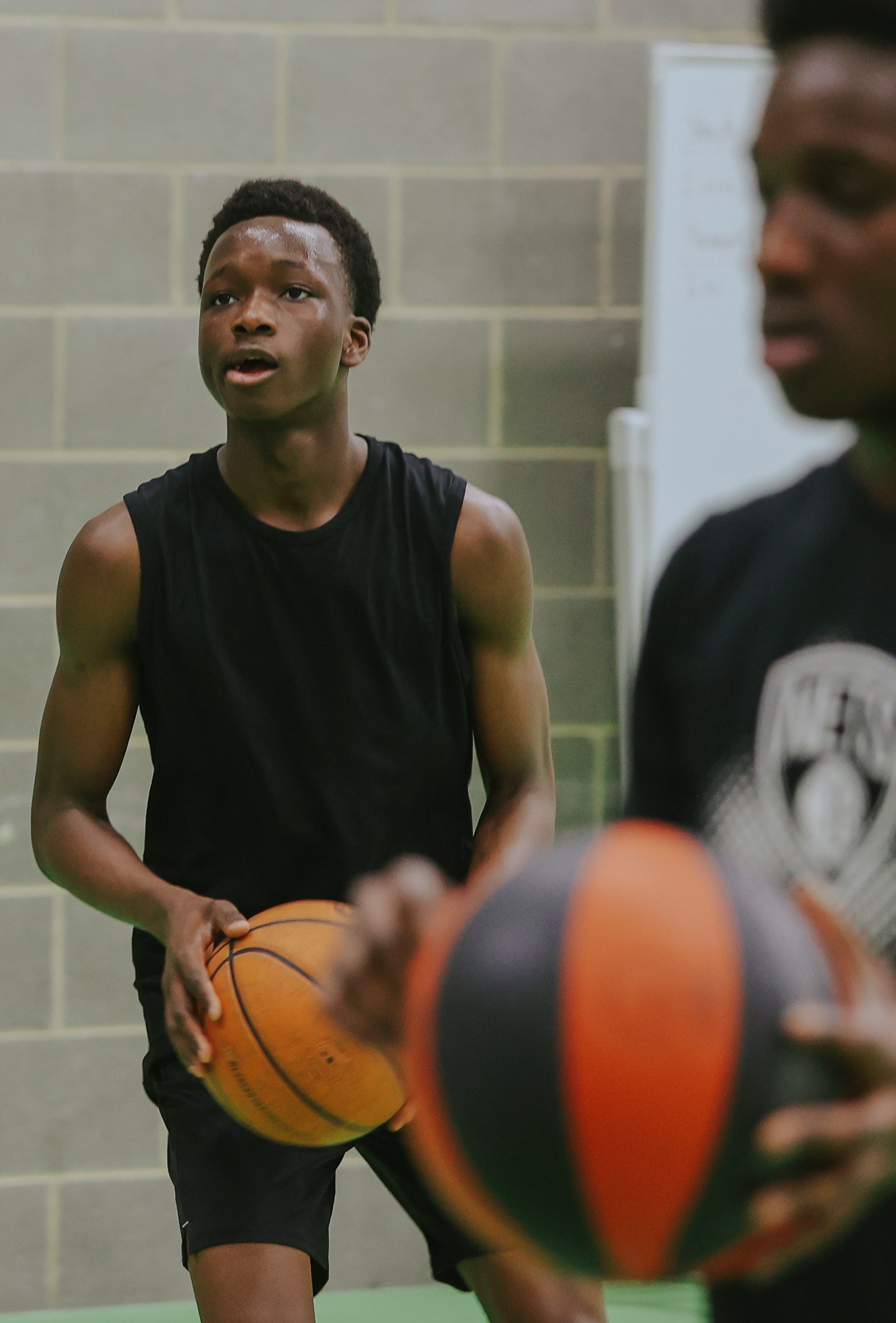 Three people playing basketball